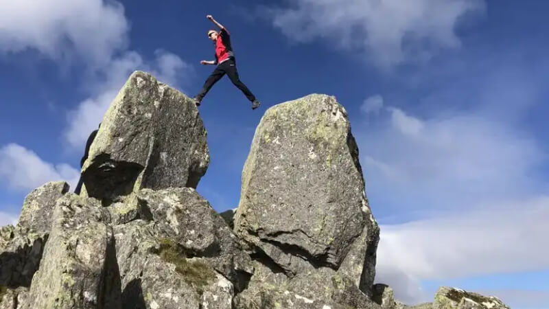 An image of someone leaping across the Tyfan pillars to support a panel about sales testing.