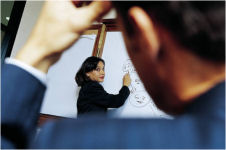A picture of a business person paying attention to illustrate our presentation skills training course description page.