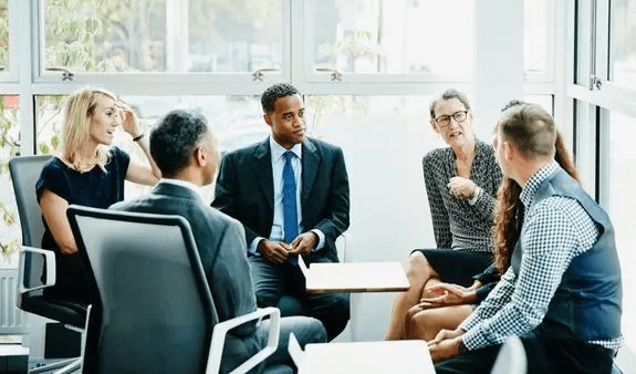A picture of a sales advisory peer group in session.