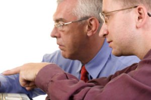 A picture of consultants discussing Consultative selling skills and consultative sales training.